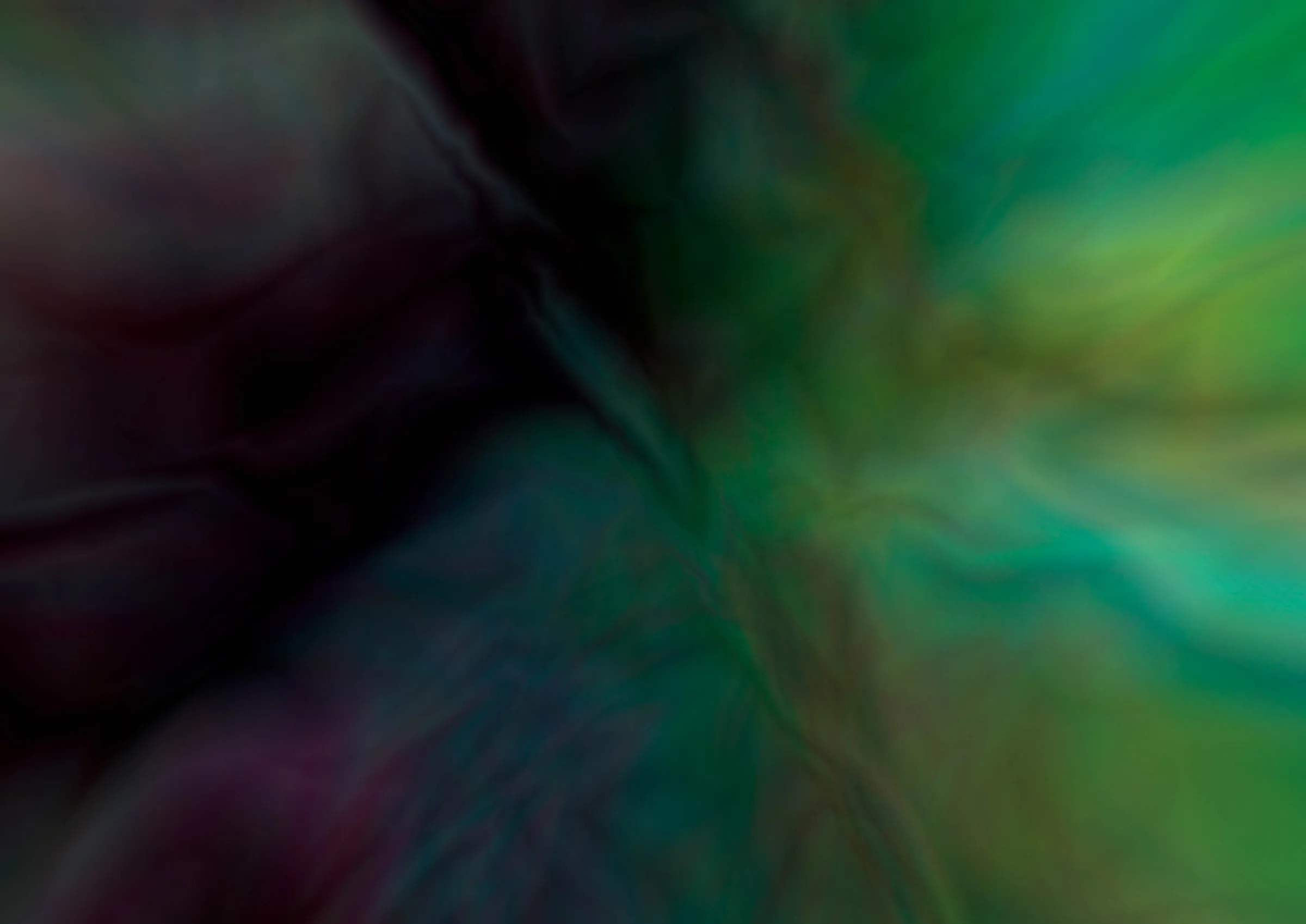 Blurred abstract image of dark purple and bright green swirling forms streaking outward from the centre